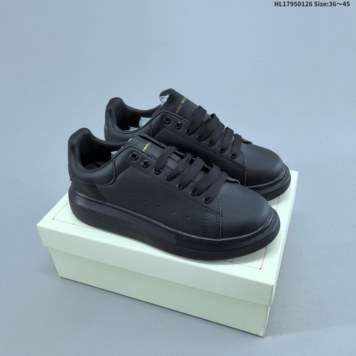 Alexander McQueen Low-Cut Sneakers in Black with Thick Sole - product image from the listing.