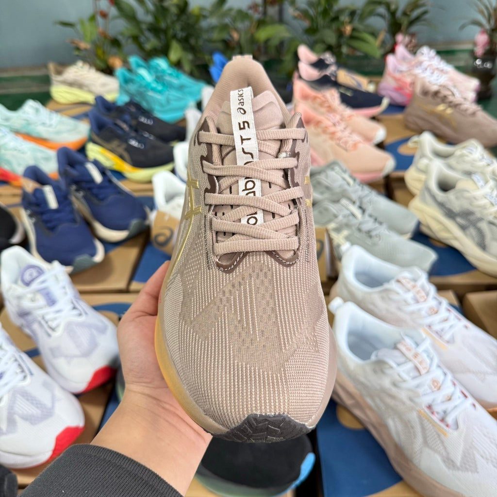 ASICS NOVABLAST 5 LE Running Shoes in Brown - product image from the listing.