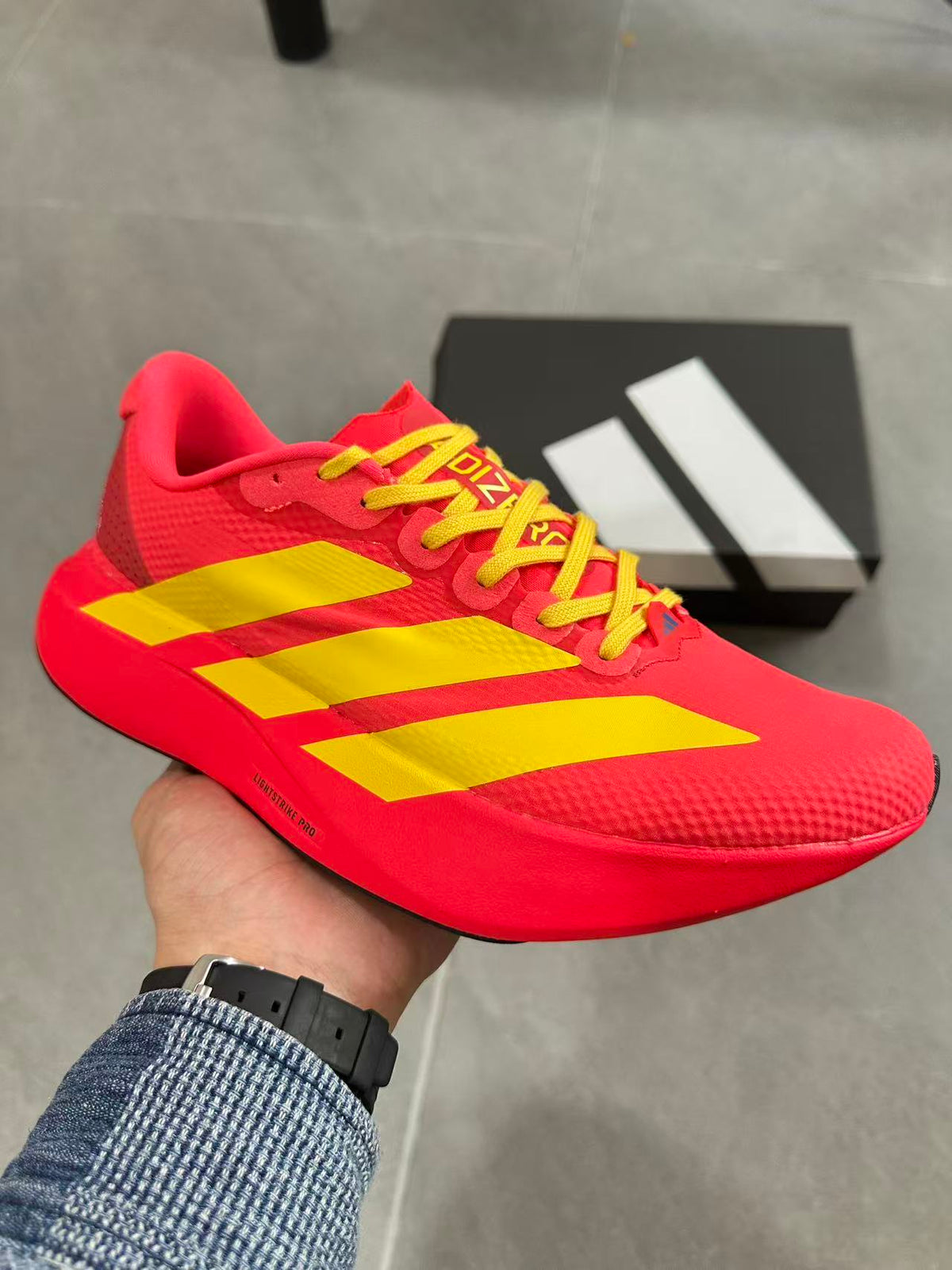 Adidas Lightstrike Pro Running Shoes in Red Yellow JQ4442 - product image from the listing.