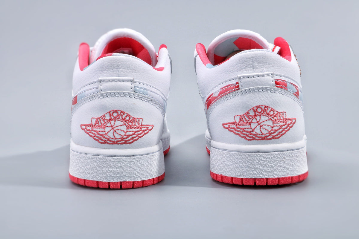 Women's Nike Air Jordan 1 Low White and Pink Sneakers - product image from the listing.