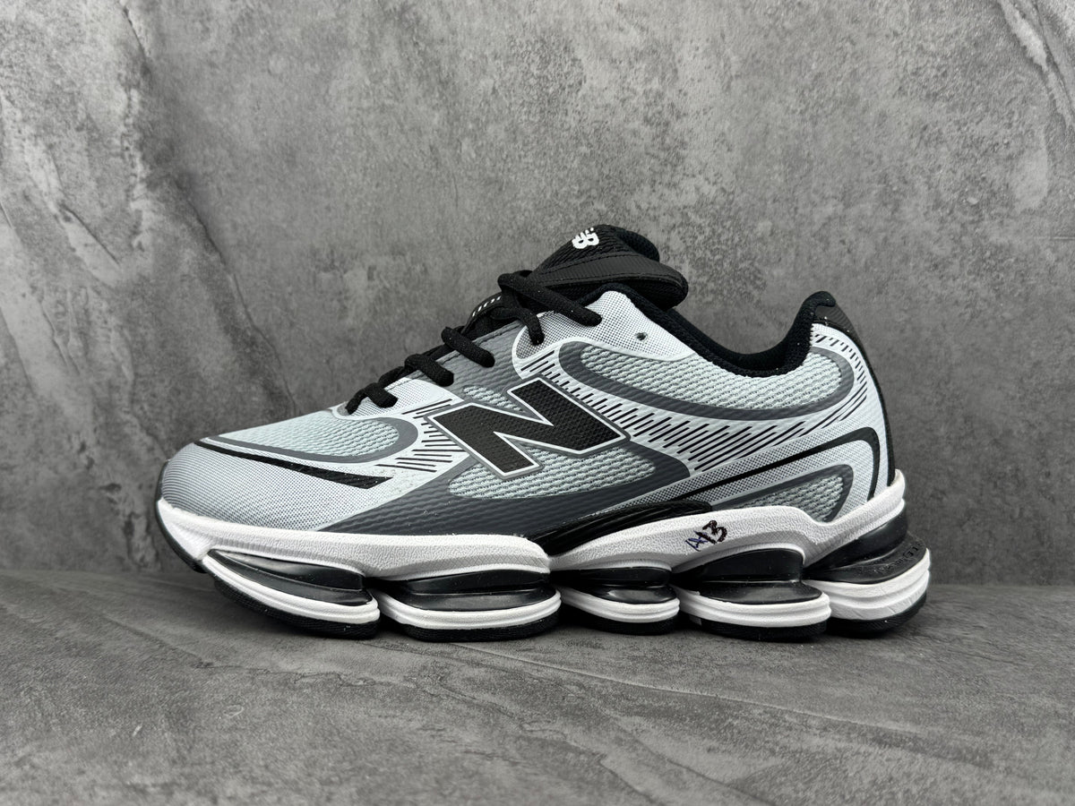 New Balance Sneakers in Silver and Black - product image from the listing.