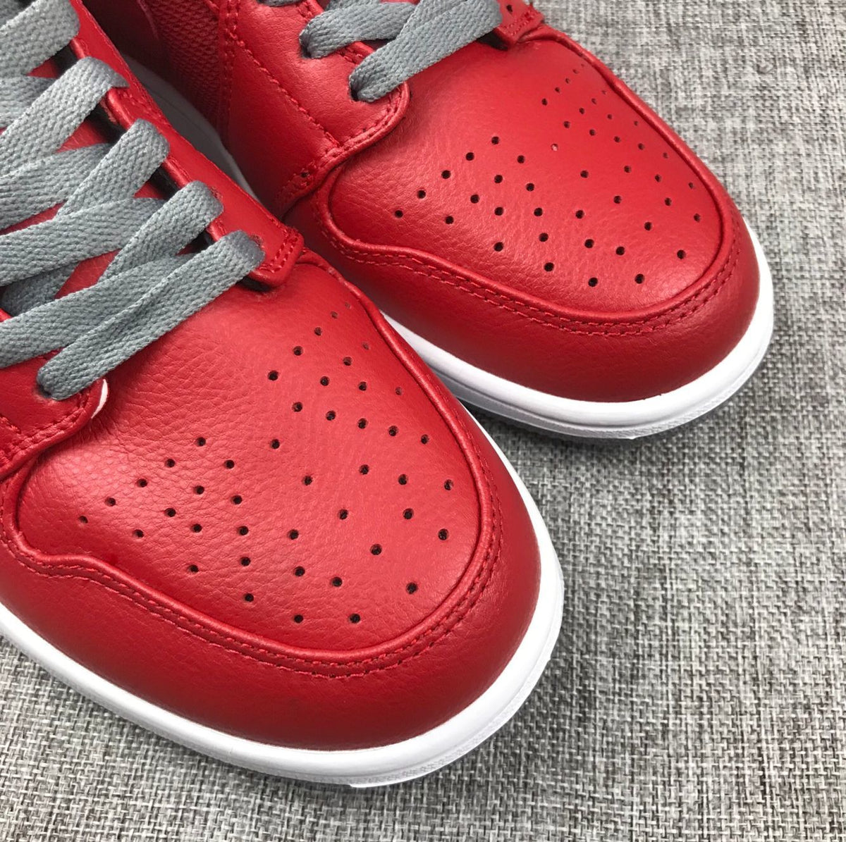 Red and Grey Jordan 1 Mid High-Top Sneakers - product image from the listing.