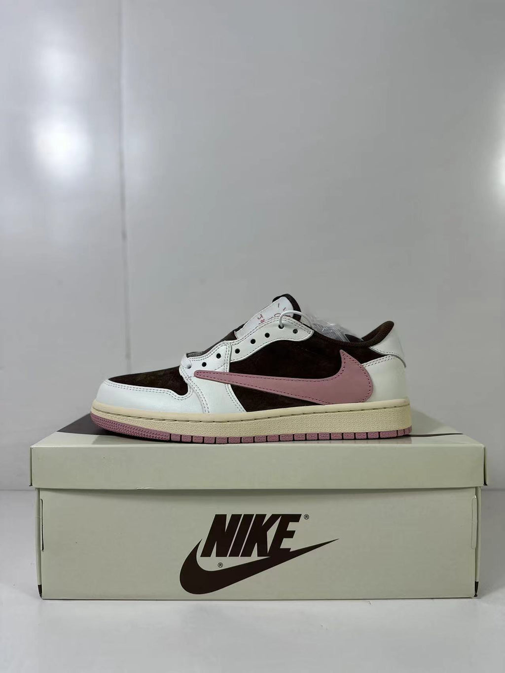 Jordan 1 Low Travis Scott in Brown White Pink DZ4137-206 - product image from the listing.
