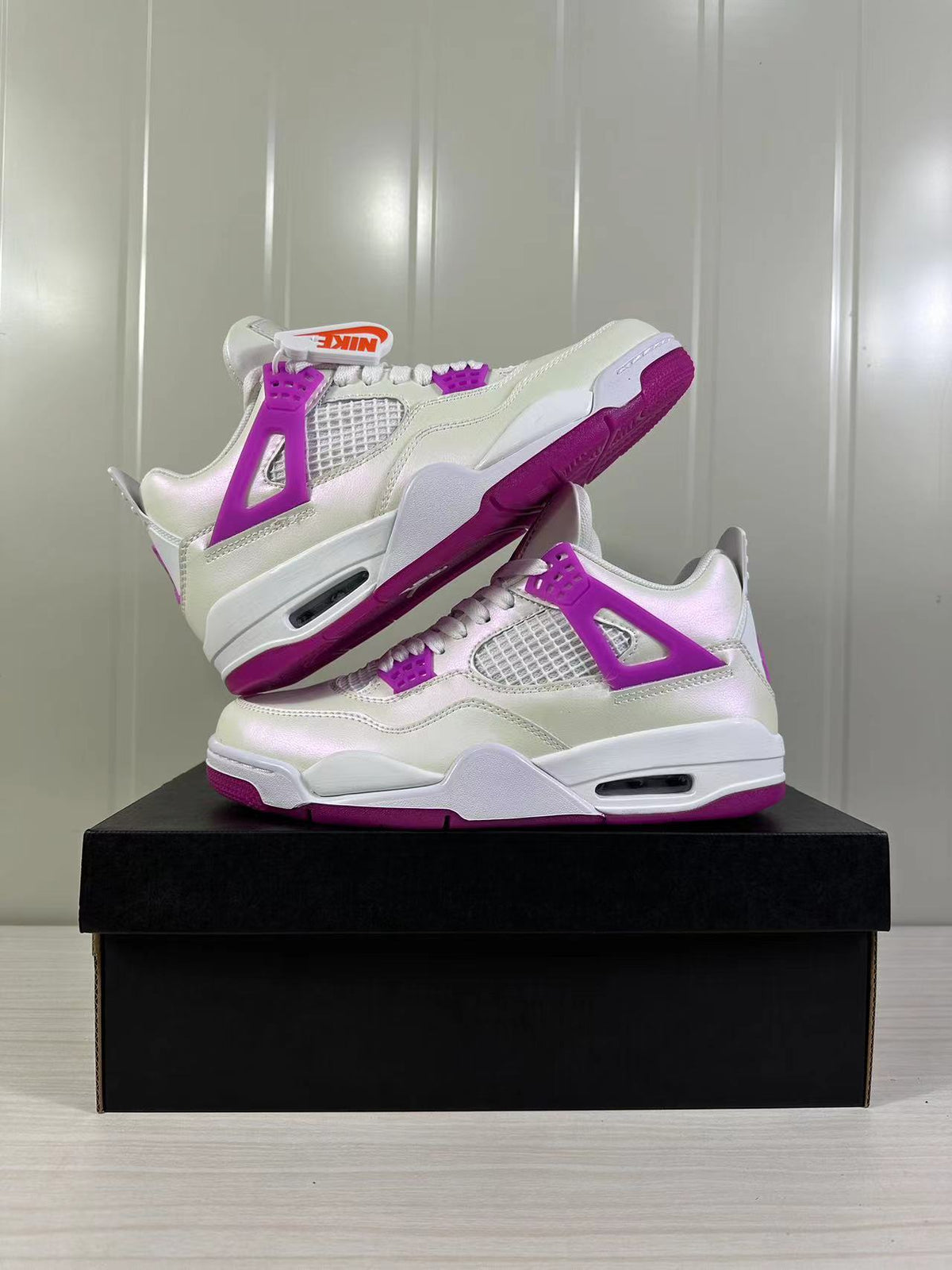 Air Jordan 4 Retro Hyper Violet Sneakers FQ1314-151 - product image from the listing.