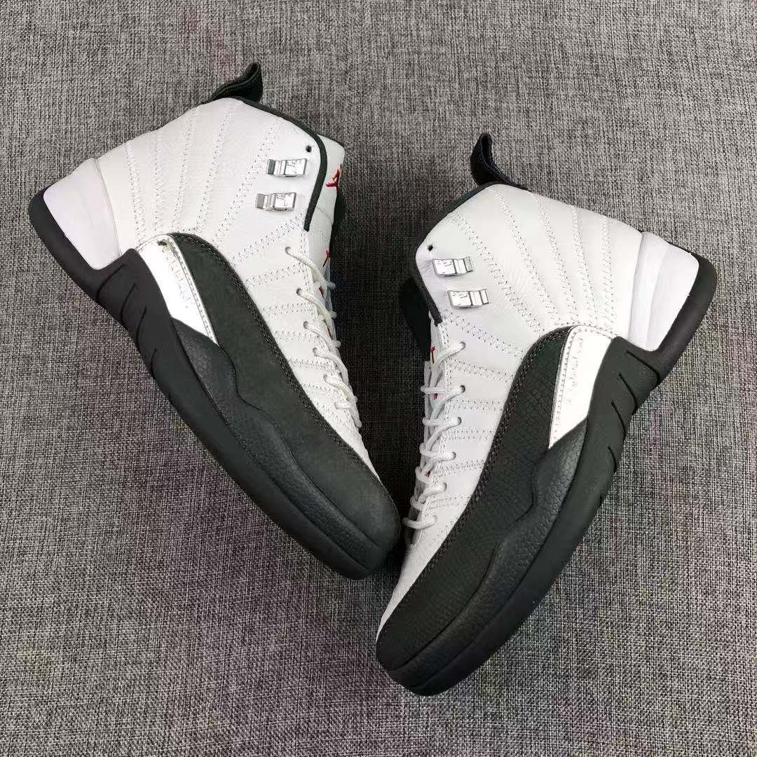 Air Jordan 12 Retro Taxi White Black Sneakers - product image from the listing.