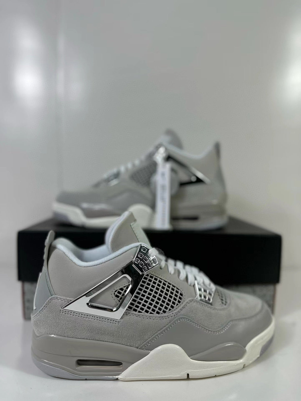 Air Jordan 4 Light Iron Ore Frozen Moments Sneakers - product image from the listing.