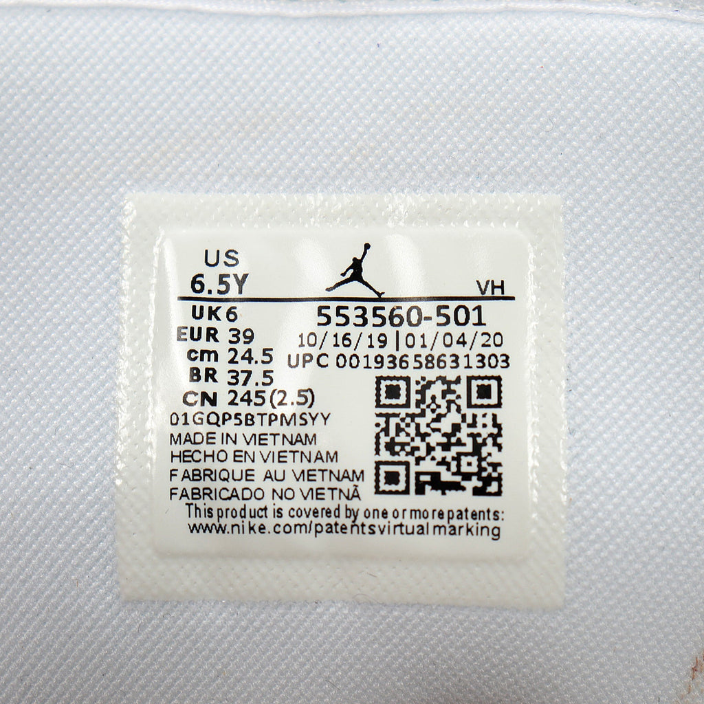 Jordan 1 Low Sneakers in Black Purple White 553560-501 - product image from the listing.