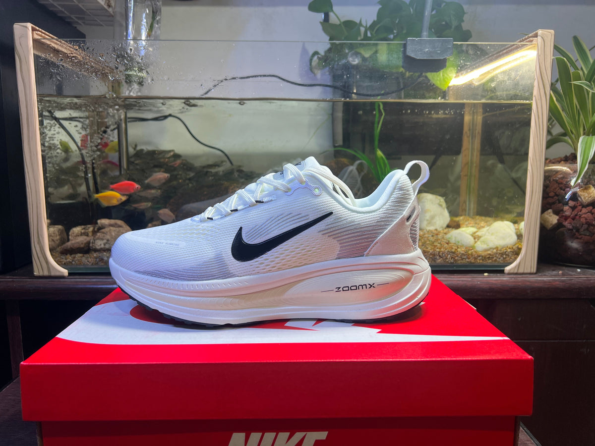 Nike Vomero 18 Running Shoes in Blue and White - product image from the listing.