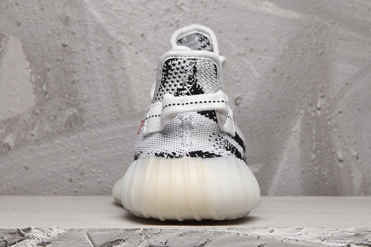 Yeezy 350 V2 Sneakers in Black and White Knit - product image from the listing.