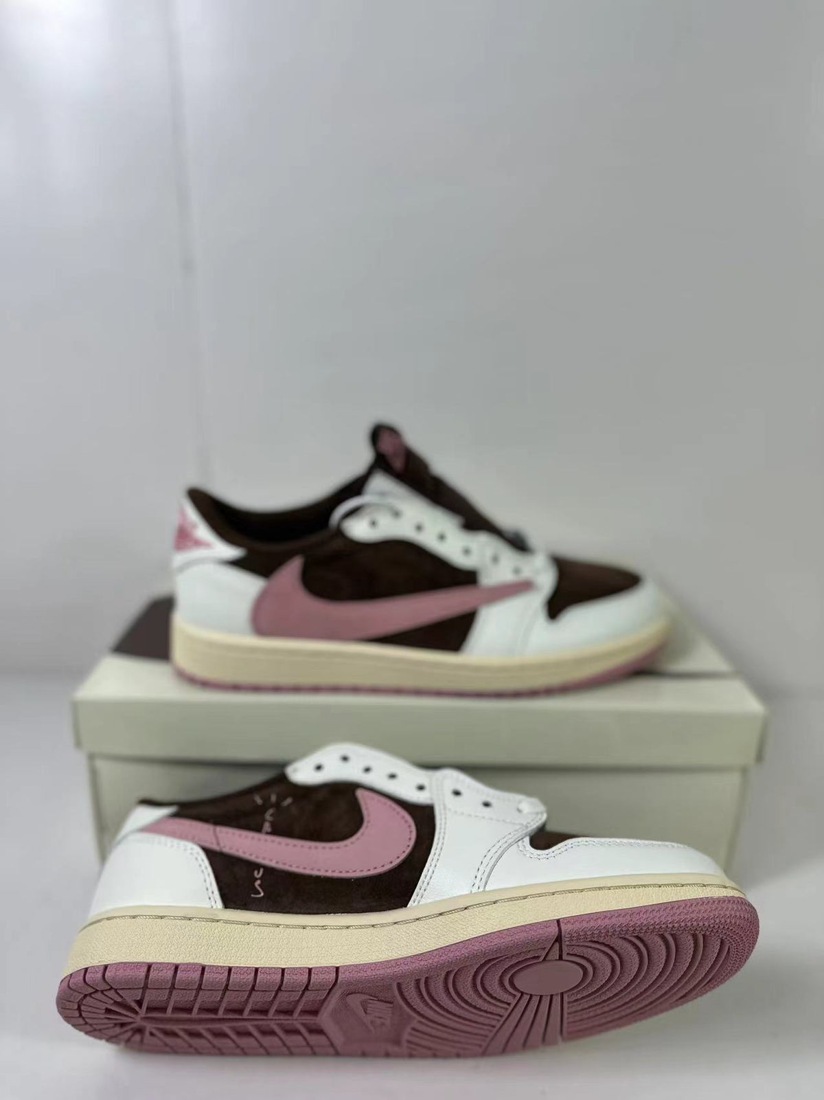 Jordan 1 Low Travis Scott in Brown White Pink DZ4137-206 - product image from the listing.