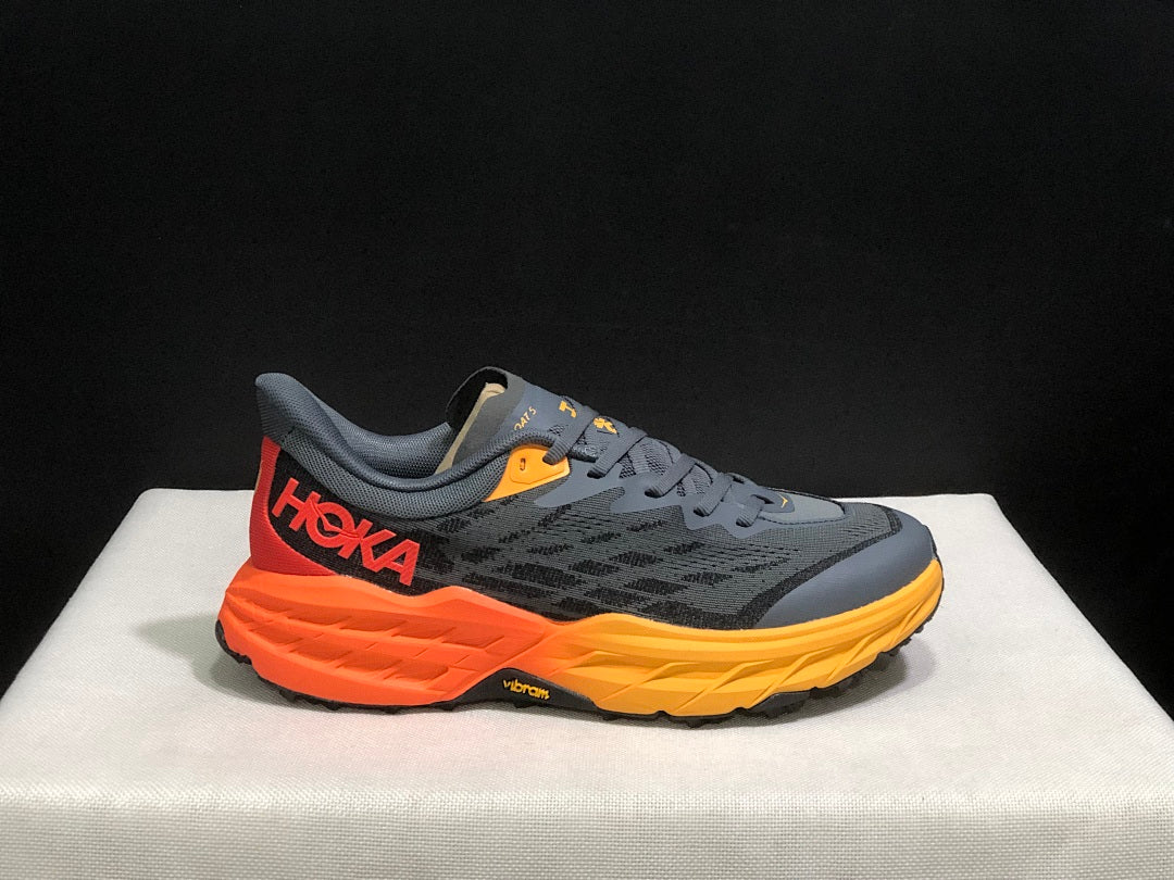 HOKA Speedgoat 5 Trail Running Shoes, in Gray and Orange - product image from the listing.