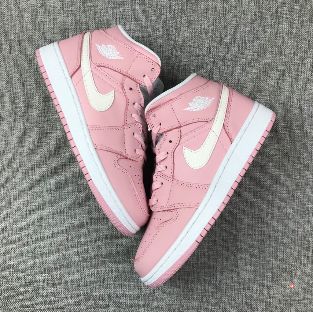 Women's Jordan 1 Mid Pink Sneakers 555112-100 - product image from the listing.