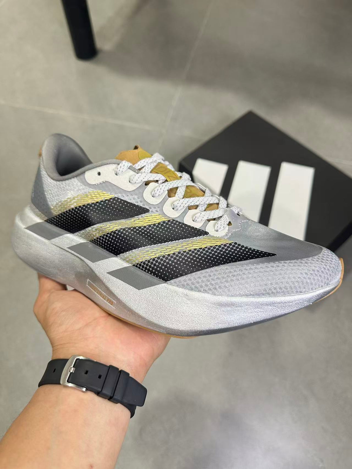 Adidas Adizero Evo SL Running Shoes in Silver Black KK4310 - product image from the listing.