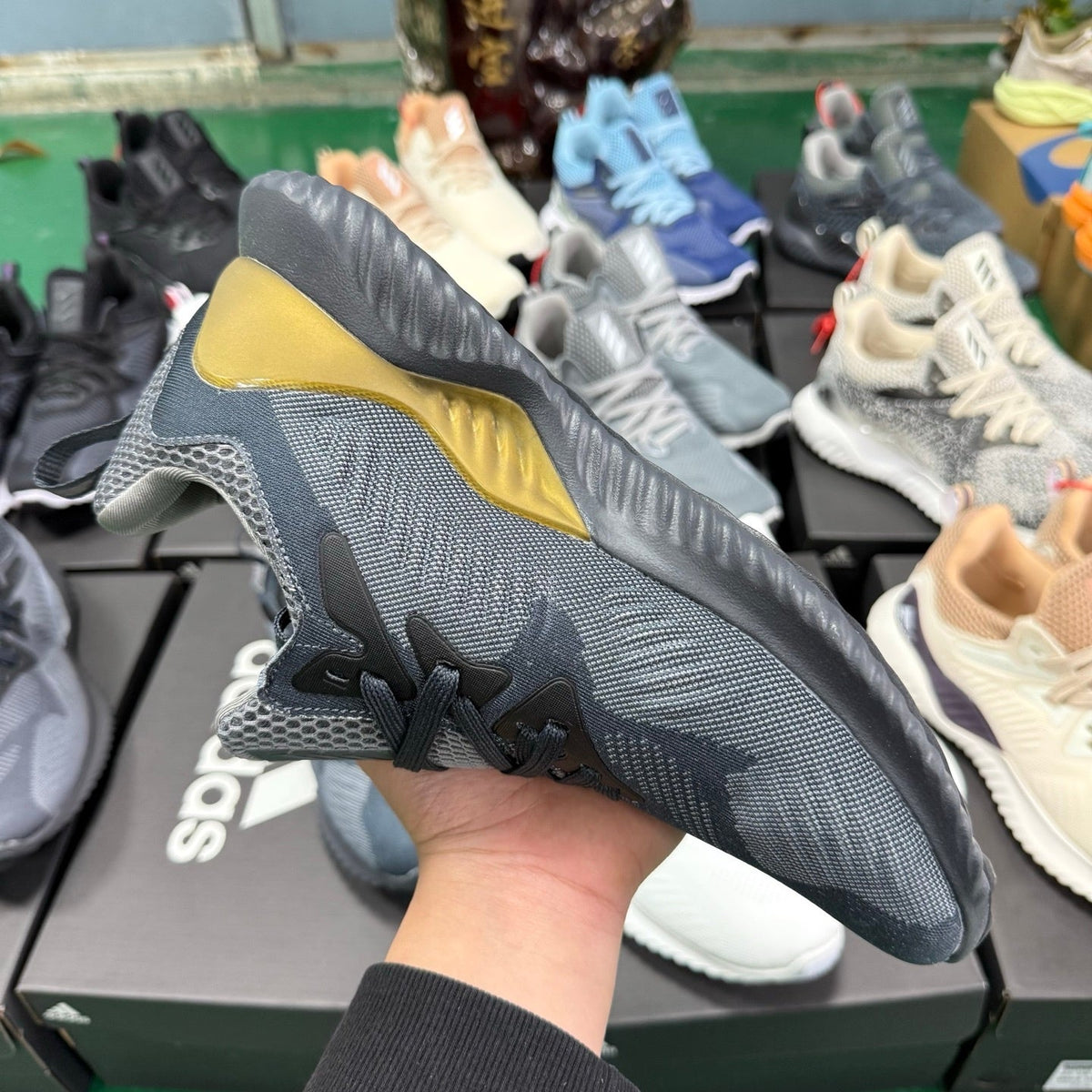 adidas Alphabounce CG4762 Sneakers, in Grey and Gold - product image from the listing.