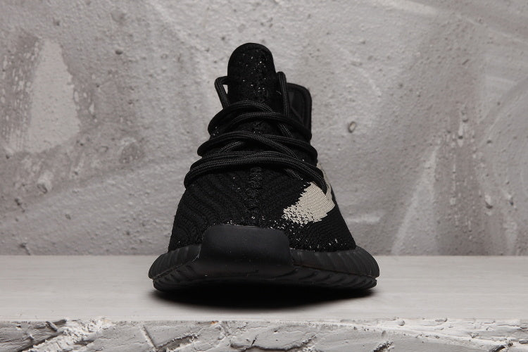 Yeezy 350 V2 Sneakers in Black and Cream Knit - product image from the listing.
