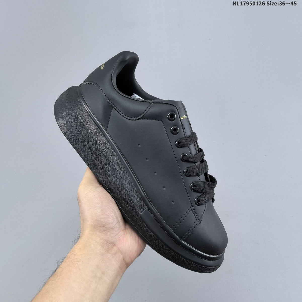Alexander McQueen Low-Cut Sneakers in Black with Thick Sole - product image from the listing.