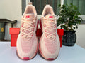 Nike Vomero 18 Running Shoes in Cream Pink - product image from the listing.