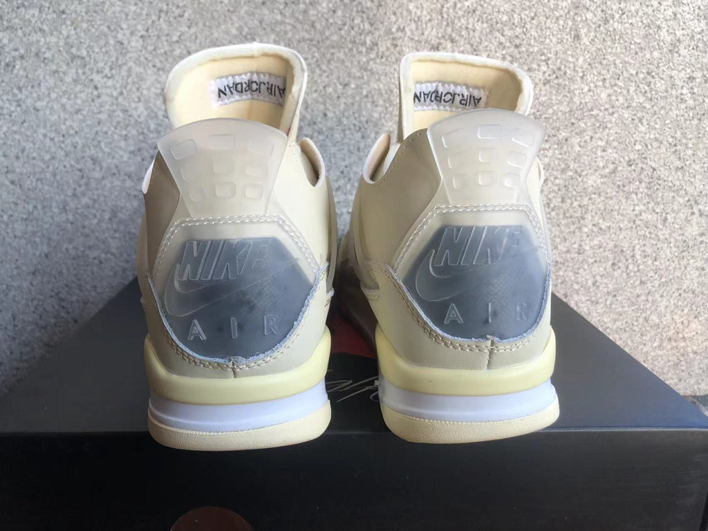 Jordan 4 Retro Sneakers in Off-White Sail - product image from the listing.
