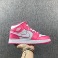 Air Jordan 1 Mid Sneakers in White Pink 555112-611 - product image from the listing.
