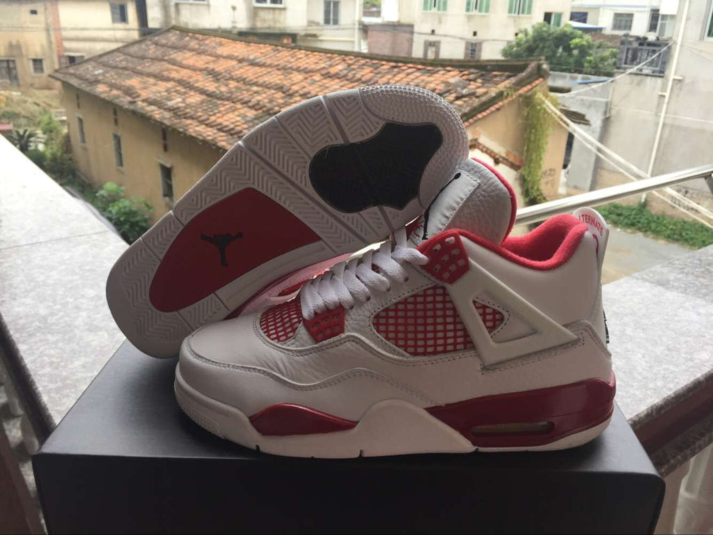 Jordan 4 Retro High-Top Sneakers in White and Red - product image from the listing.