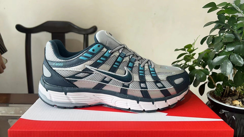 Nike P-6000 Sneakers in White Navy Turquoise CD6404-402 - product image from the listing.