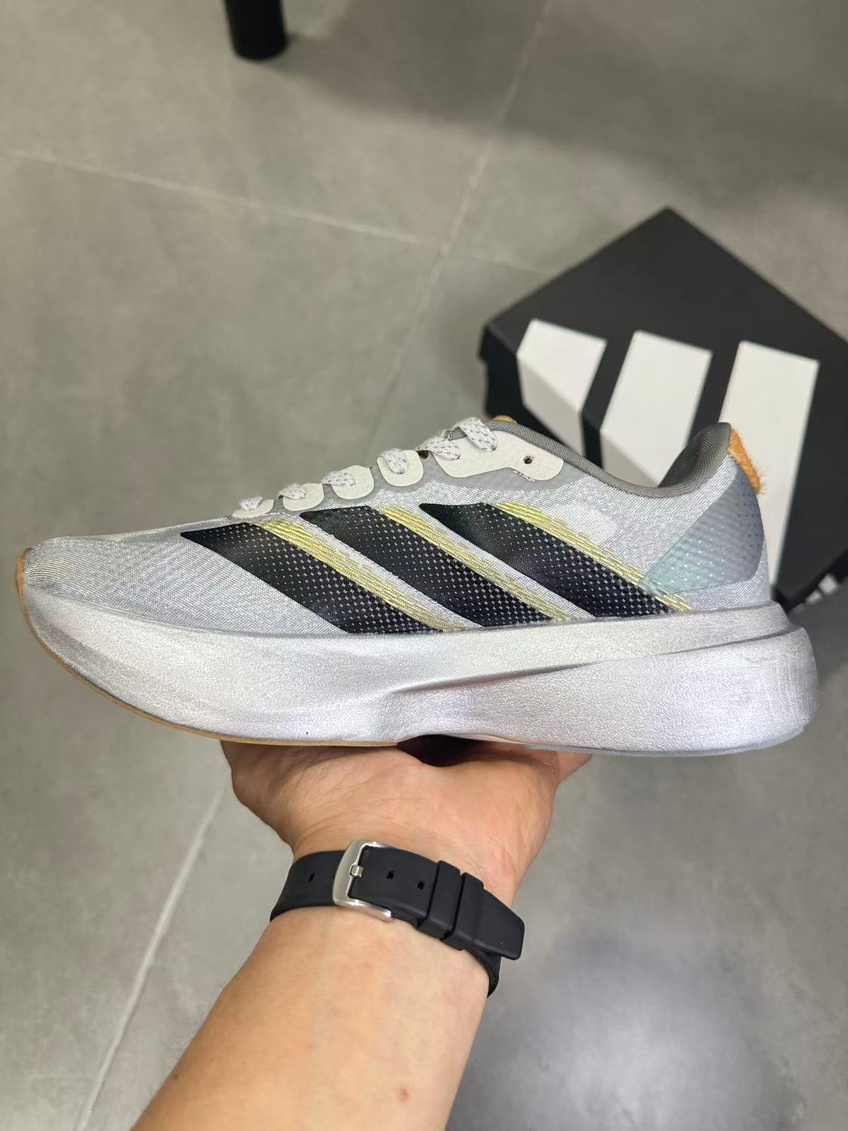 Adidas Adizero Evo SL Running Shoes in Silver Black KK4310 - product image from the listing.