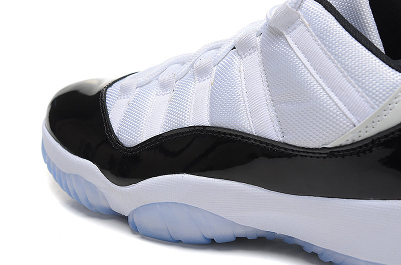 Air Jordan 11 Low Basketball Sneakers in White Black - product image from the listing.