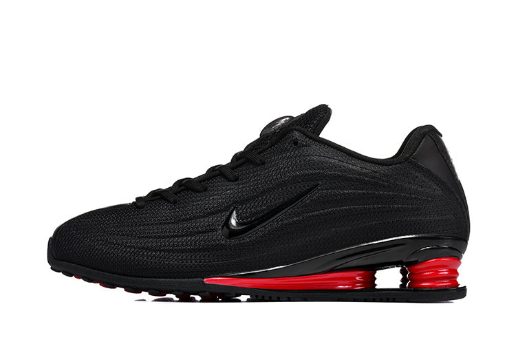 Nike Low-Top Sneakers in Black and Red - product image from the listing.