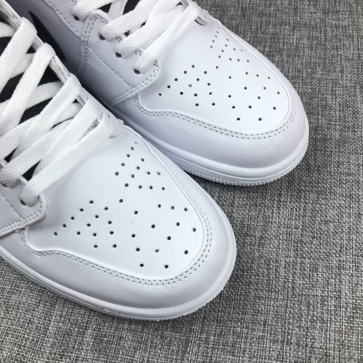 Air Jordan 1 Mid Sneakers in White Red 554724-116 - product image from the listing.