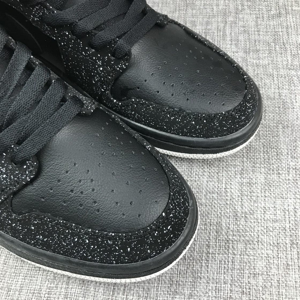 Air Jordan 1 Mid Black and White Sneakers 554724-001 - product image from the listing.