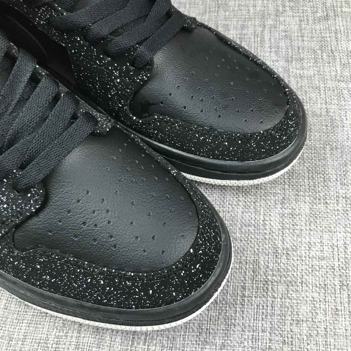 Air Jordan 1 Mid Black and White Sneakers 554724-001 - product image from the listing.