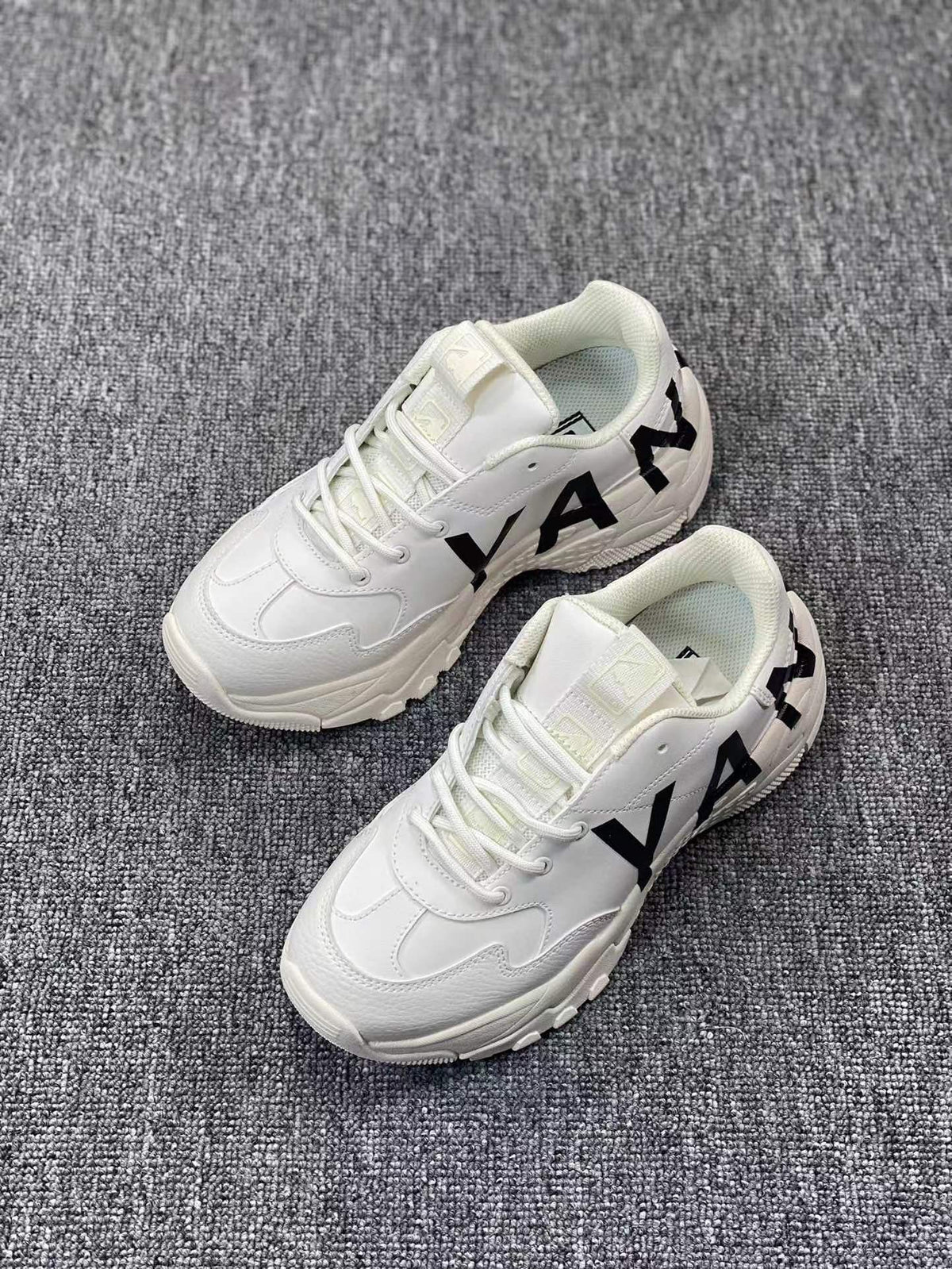 White Chunky Low-Cut Sneakers with Black Side Graphics - product image from the listing.