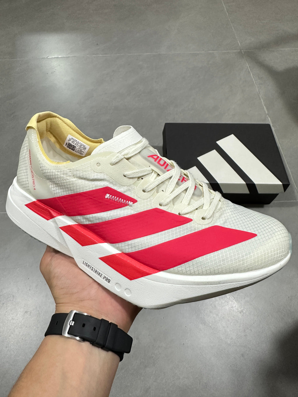 adidas Lightstrike Pro Running Shoes in White Red JR4542 - product image from the listing.
