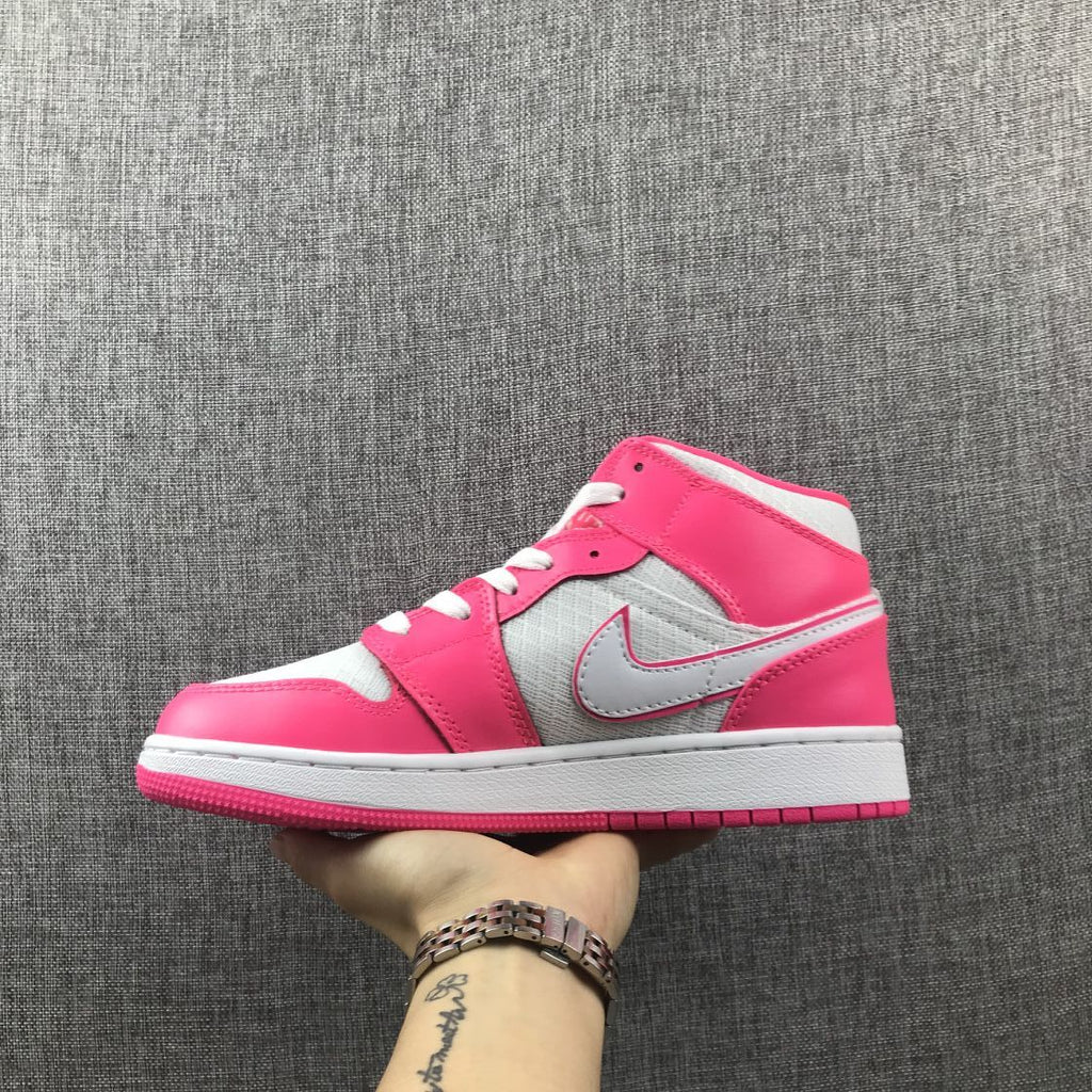 Air Jordan 1 Mid Sneakers in White Pink 555112-611 - product image from the listing.