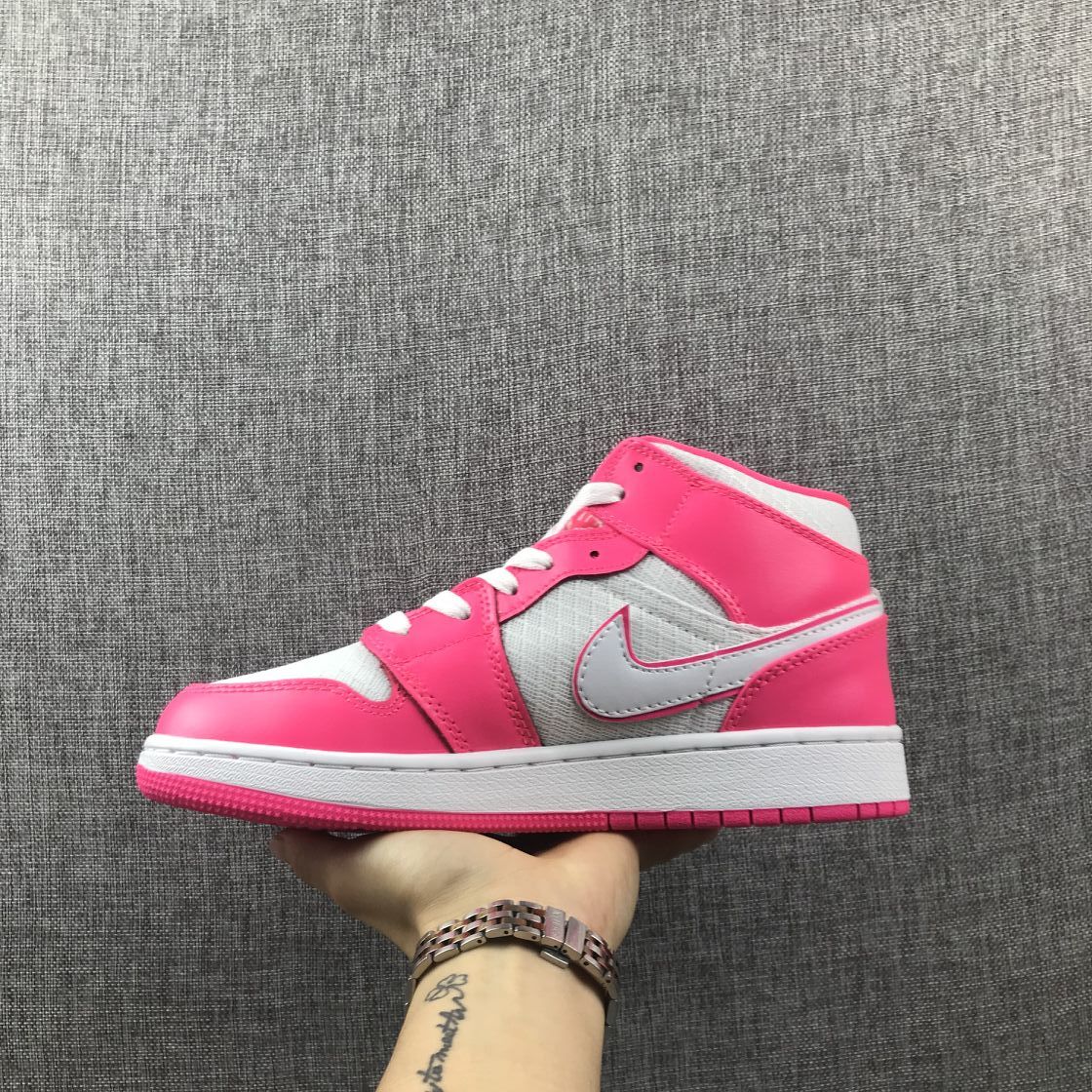 Air Jordan 1 Mid Sneakers in White Pink 555112-611 - product image from the listing.