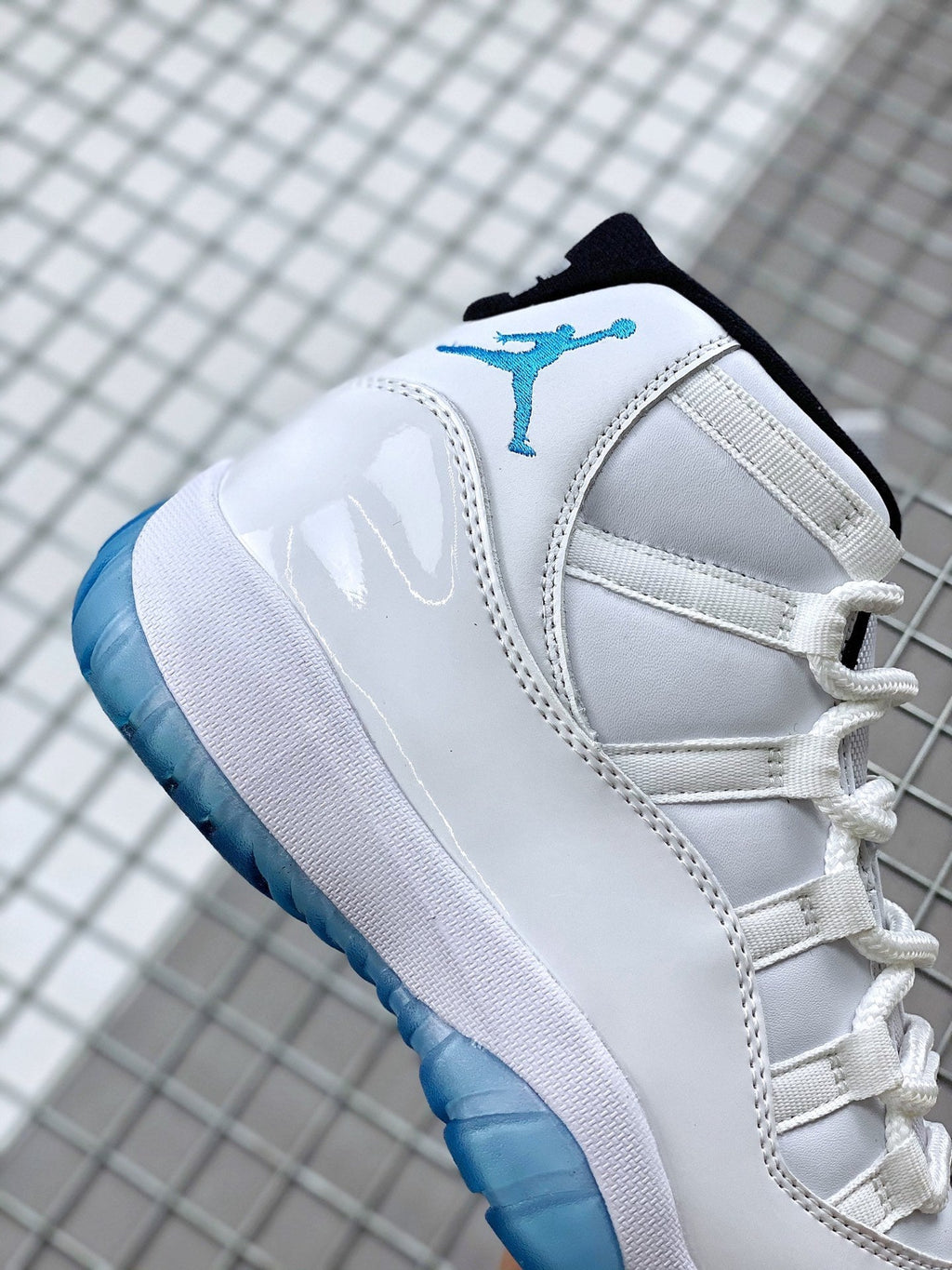 Jordan 11 Legend Blue Sneakers in White Blue 378037-117 - product image from the listing.