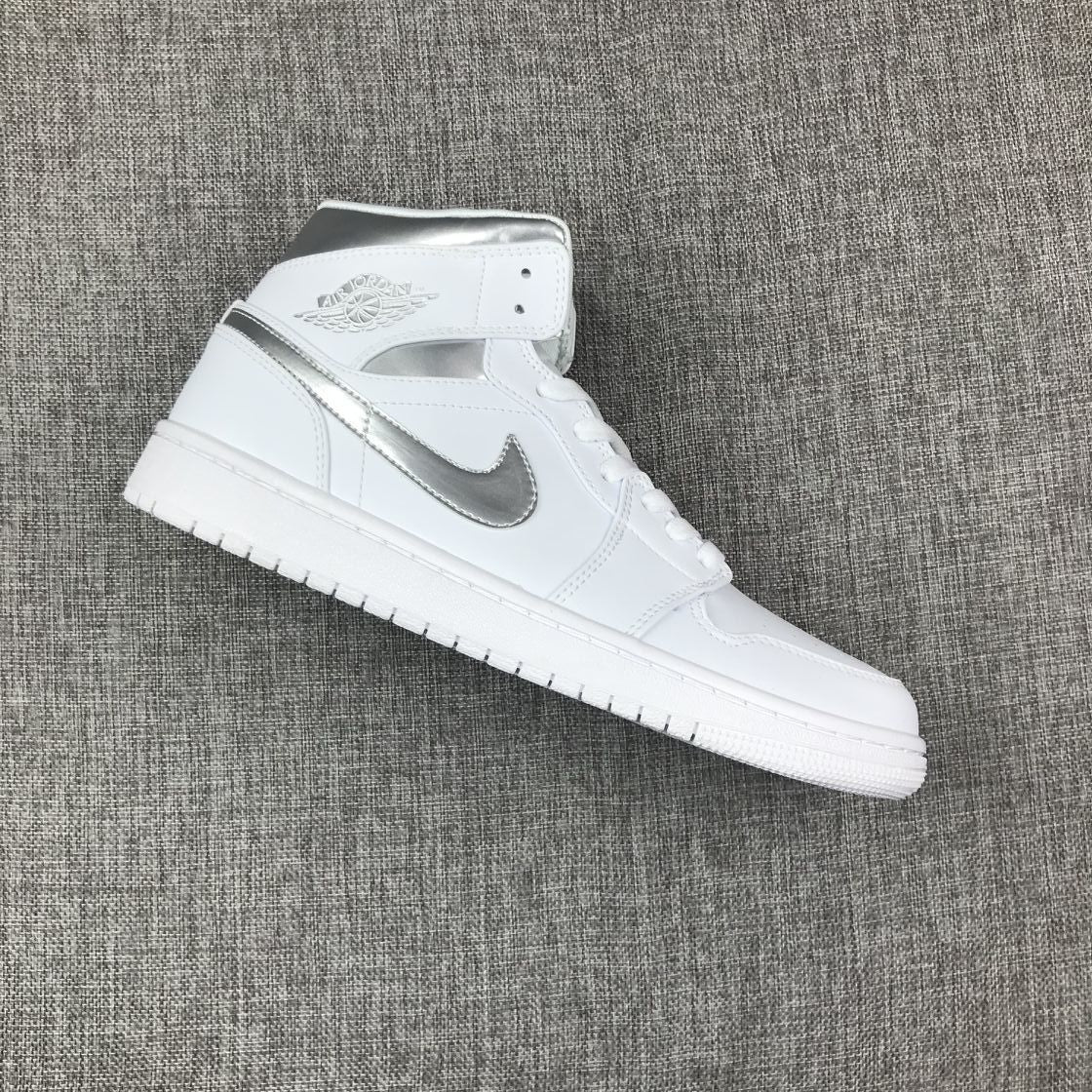 Air Jordan 1 Mid Sneakers in White Silver 554724-105 - product image from the listing.