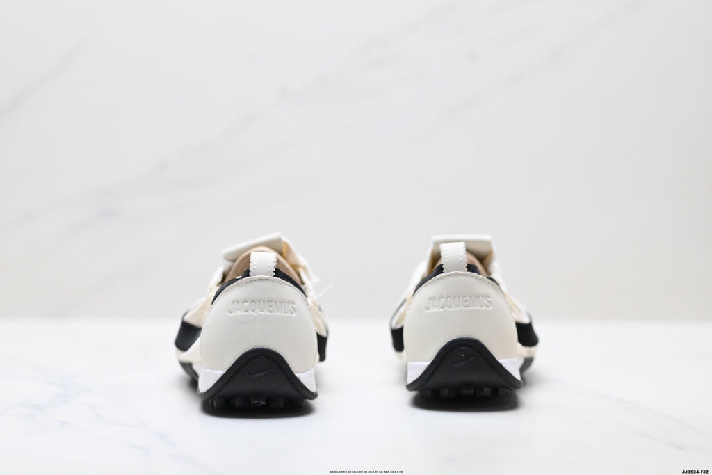 Jacquemus x Nike Jacumoon Low-Top Sneakers, in White and Black - product image from the listing.