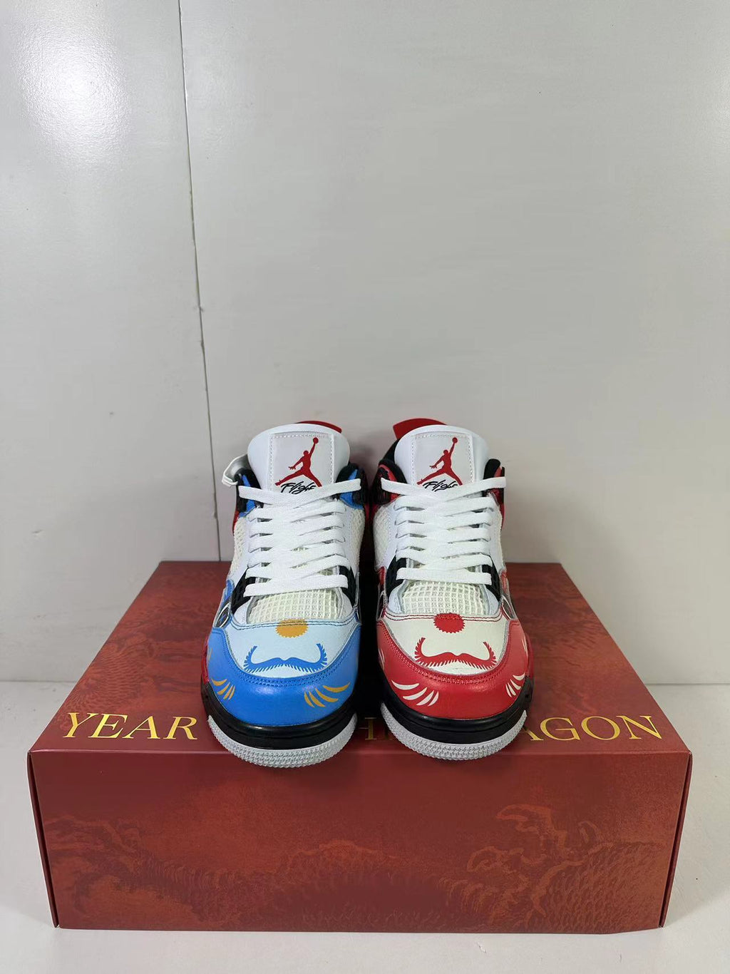 Air Jordan 4 Chinese New Year Red Blue Sneakers DH6927-161 - product image from the listing.