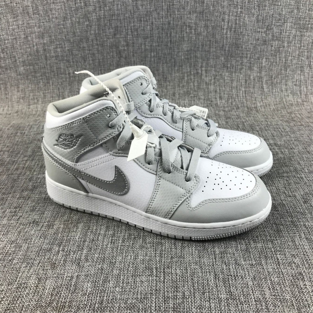 Air Jordan 1 Mid GS White and Silver Sneakers - product image from the listing.