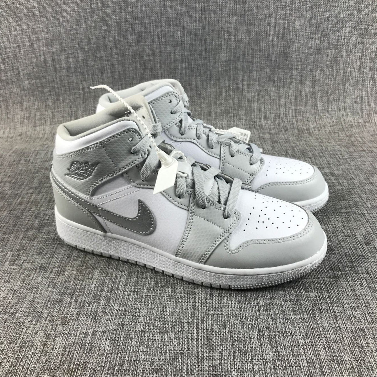 Air Jordan 1 Mid GS White and Silver Sneakers - product image from the listing.