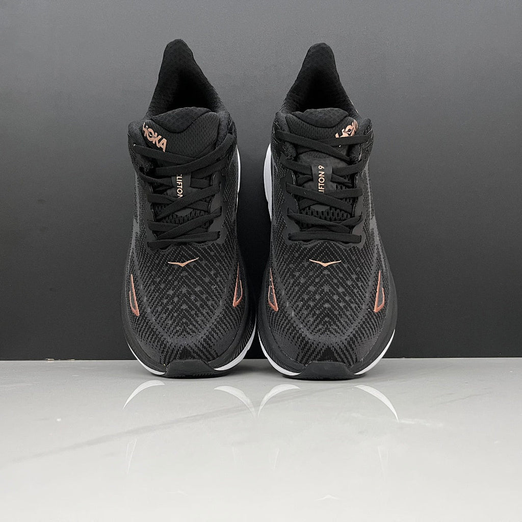 HOKA Clifton 9 Running Shoes in Black and Gold - product image from the listing.