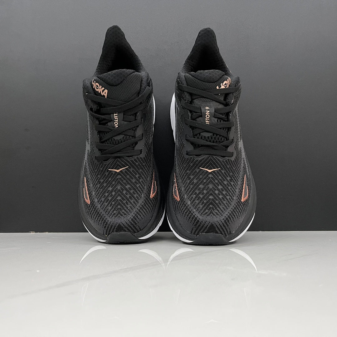 HOKA Clifton 9 Running Shoes in Black and Gold - product image from the listing.