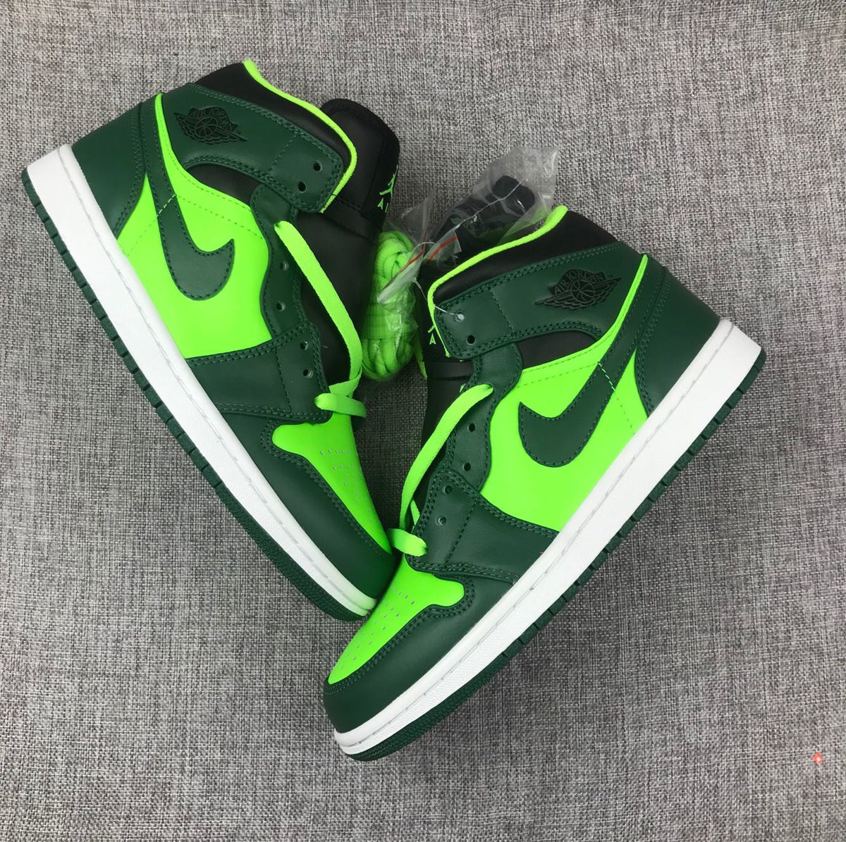Air Jordan 1 Mid Fluorescent Sneakers in Green 554724-330 - product image from the listing.