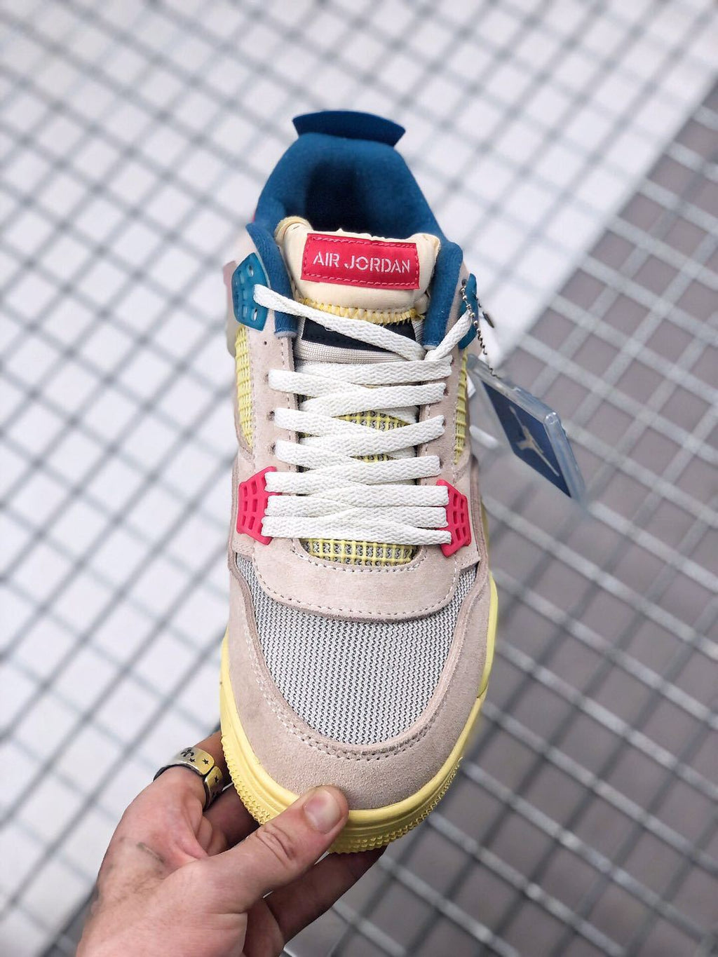 Union x Air Jordan 4 Sneakers in Pink Beige Navy Yellow - product image from the listing.