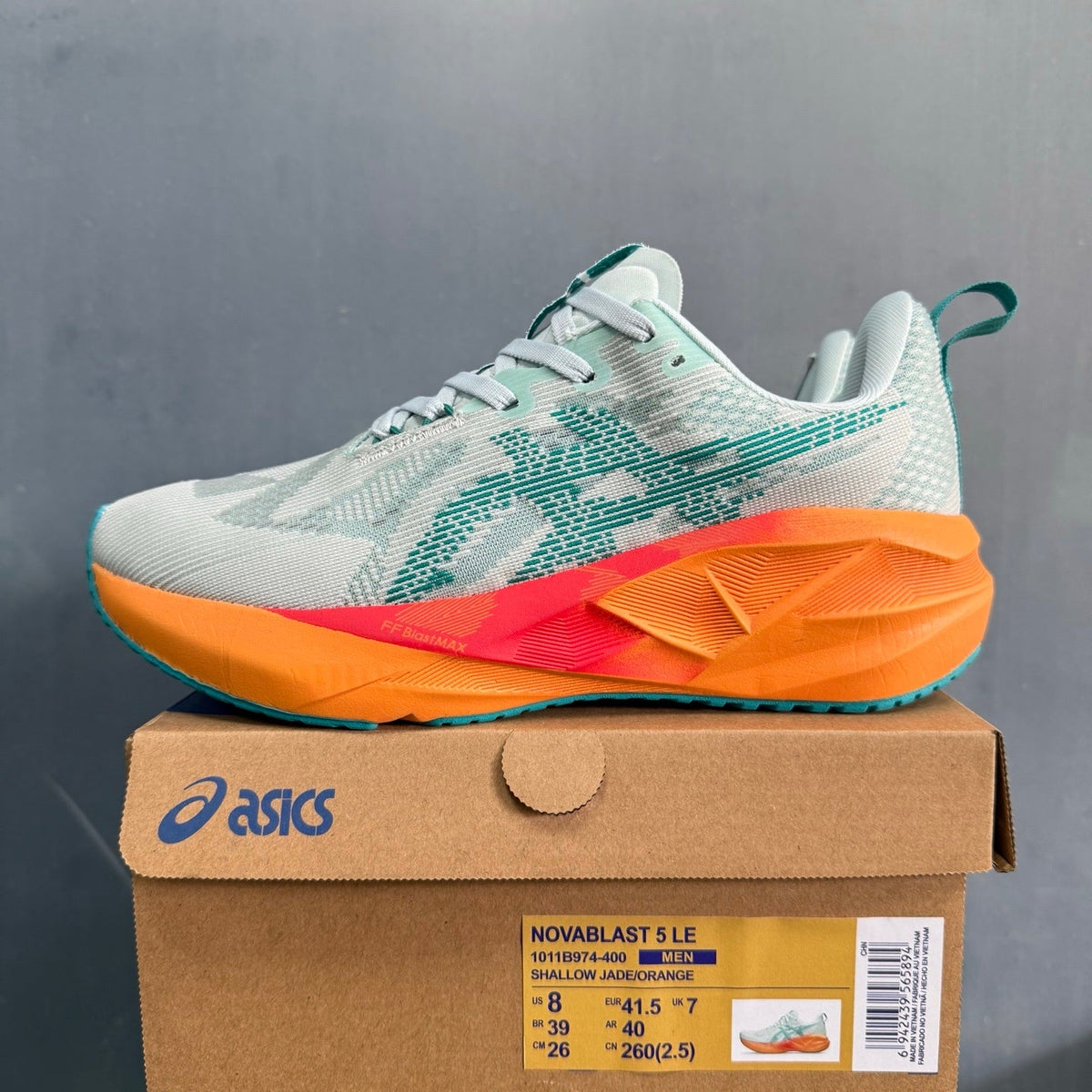 ASICS NOVABLAST 5 LE Running Shoes in White Orange - product image from the listing.