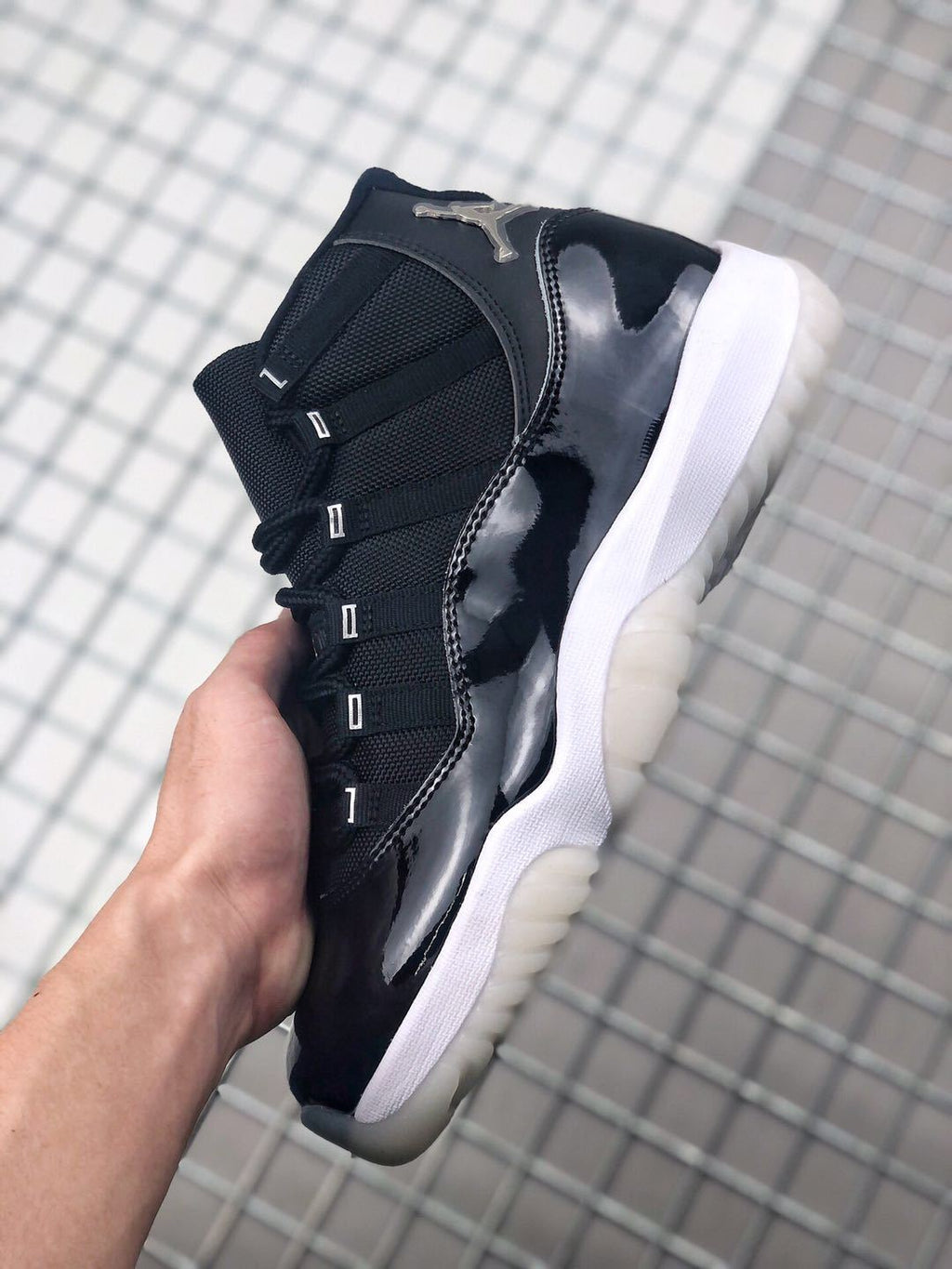 Air Jordan 11 Silver Eyelets Black White Sneakers - product image from the listing.