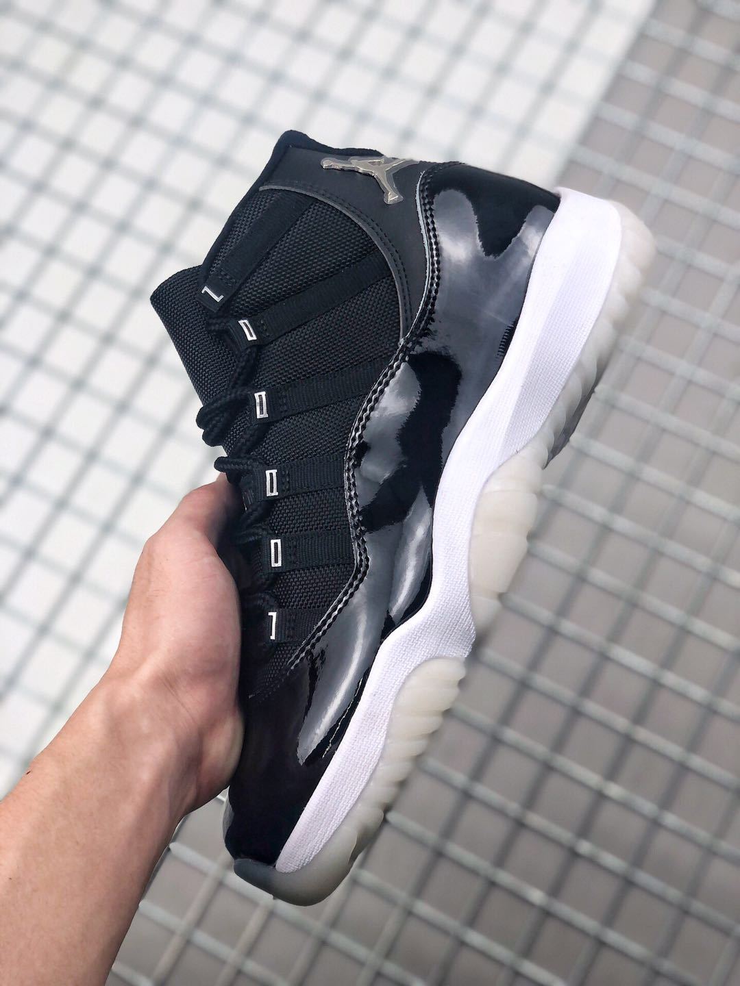 Air Jordan 11 Silver Eyelets Black White Sneakers - product image from the listing.