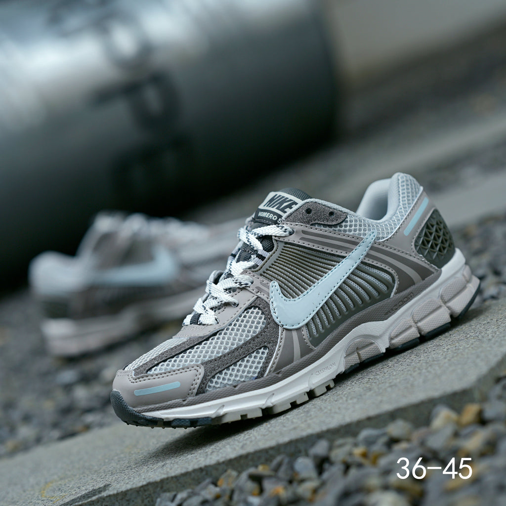 Grey Nike Air Zoom Vomero 5 Running Shoes - product image from the listing.