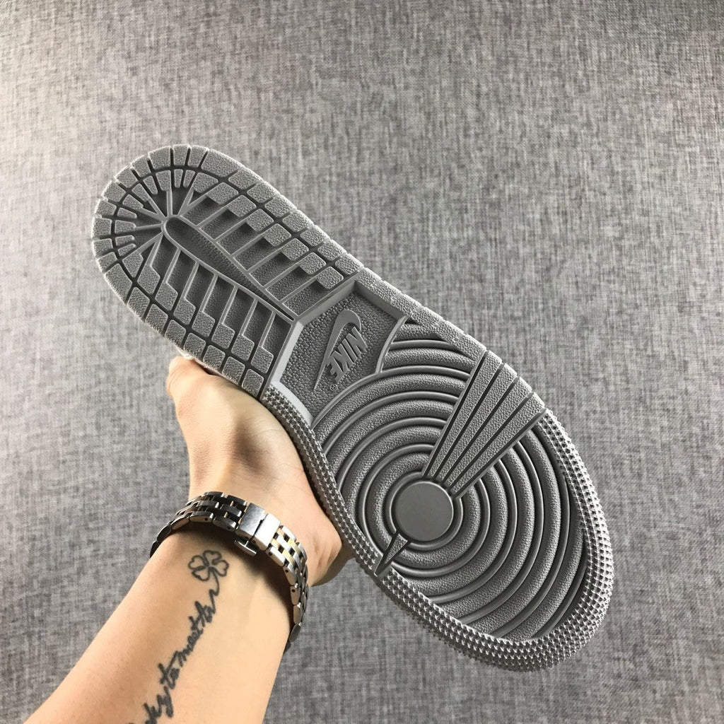 Air Jordan 1 Mid GS White and Silver Sneakers - product image from the listing.